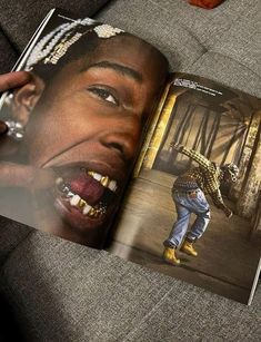 an open magazine showing a man with his mouth open