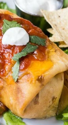 a close up of food on a plate with chips