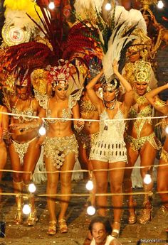 several women dressed in costumes standing next to each other