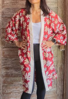 Get ready to dazzle in this stunning red kimono robe! Perfect as a long cardigan or summer top, this versatile piece will elevate any outfit, whether you're dressing up for a rave or getting ready for a special occasion. The flowy design makes it a fabulous beach cover up, ideal for lounging in style. Surprise your wife with this elegant kimono robe as a birthday gift that she'll cherish for years to come. Detail's:  ● Size: All size, please see the details below.  ● Width: circumference 125 cm Red V-neck Kimono For Summer, Red Spring Robe For Loungewear, Red Long Sleeve Robe For Summer, Red Long Sleeve Summer Robe, Long Red Summer Robe, Red Long Sleeve Kimono For Vacation, Red Long Sleeve Kimono For Spring, Red Wrap Kimono For Spring, Red Open Front Kimono For Spring