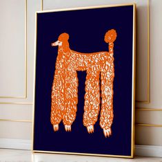 an orange and blue art piece with two poodles hanging from it's sides