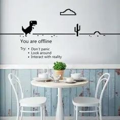 a table and chairs in front of a wall with the words you are offline