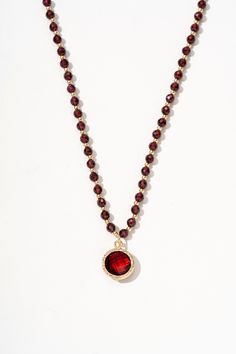 Calista Ruby Mix Pendant Necklace - Artsory Red Faceted Pendant Necklaces, Red Faceted Pendant Necklace, Festive Ruby Gemstone Beads Jewelry, Festive Ruby Gemstone Bead Jewelry, Spiritual Beaded Chain Jewelry With Round Pendant, Spiritual Style Round Pendant With Beaded Chain, Spiritual Beaded Chain With Round Pendant, Spiritual Round Pendant With Beaded Chain, Red Garnet Beaded Necklaces With Round Beads