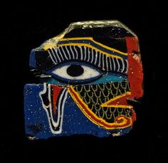 an ancient egyptian mask with blue eyes