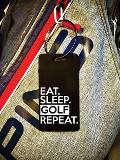 a bag with a tag that says eat sleep golf repeat