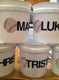 six buckets with baseball logos on them