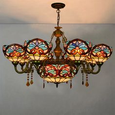 a stained glass chandelier hanging from the ceiling