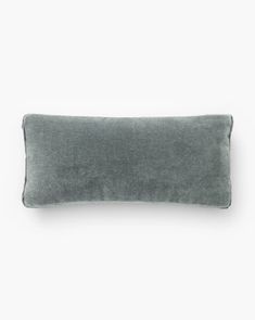 a gray pillow on a white background