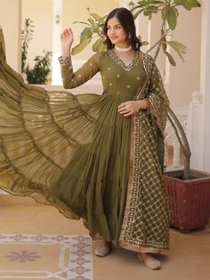 Introducing our stunning "adorable olive green embroidered georgette mehendi wear gown", a classy and elegant choice for your next special event. This beautifully crafted gown comes in a rich olive green color with intricate embroidered and sequin work, making it a perfect outfit for festivals, events, or any function.
This gown include a fully stitched design in sizes ranging from XS to XXL, a generous 15-meter flair for a glamorous look, and a gown length of 56 inches. The accompanying georget Green Maxi Length Designer Traditional Wear, Traditional Drape Green Georgette Dress, Green Chikankari Embroidery Maxi Kurta, Green Maxi Length Kurta With Chikankari Embroidery, Green Georgette Maxi Length Traditional Wear, Green Georgette Anarkali Set For Reception, Green Traditional Wear With Zari Work, Maxi Length, Green Anarkali Set With Resham Embroidery In Maxi Length, Green Traditional Maxi With Zari Work