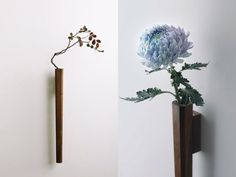 there are two vases with flowers in them and one has a stick sticking out of it