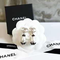 From The 2021 Cruise Collection Authentic Chanel Pearl Camelia Drop Cc Earrings Stamped 21 And Made In France *Comes With Box And Ribbon. -Approximately 0.6" X 1.75" Rare And Unique Style. Camelia Black Flower Design And Bottom Of Pearl Drop, Gold Tone Hardware And Crystal Cc Posts. Excellent Condition, No Signs Of Use To Note Chanel Jewelry Earrings, Chanel Aesthetic, Replica Jewelry, Chanel Pearls, Chanel Earrings, Classic Earrings, Chanel Jewelry, Crystal Drop Earrings, Stunning Earrings