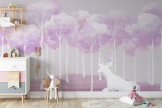 a child's room decorated in pastel tones with pink and purple wallpaper