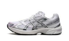 The Women’s ASICS Gel-1130 “White/Faded Ash Rock” is a women’s-exclusive colorway of the retro performance running shoe with a highly versatile design.  The shoe’s upper features a white mesh base and is contrasted with Metallic Silver and Faded Ash Rock-colored synthetic overlays.  Both “ASICS” and “Gel-1130” branding are seen on the mesh tongue.  The shoe’s techy-looking midsole features Gel cushioning, providing the wearer with a comfortable ride.  Release date: January 1, 2024 Asics Outfits, Asics Gel 1130, Pretty Shoes Sneakers, Shoe Wishlist, Glitter Sneakers, Sport Shoes Women, Asics Shoes, Stadium Goods, Pinterest Closet