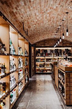 a store filled with lots of bottles and shelves