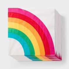 folded napkins with multicolored rainbow design