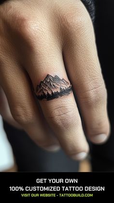 a hand with a mountain tattoo on it's finger and the words get your own 100