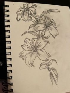 a pencil drawing of flowers on a piece of paper