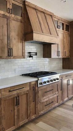 a large kitchen with wooden cabinets and white counter tops is featured on the instagram page