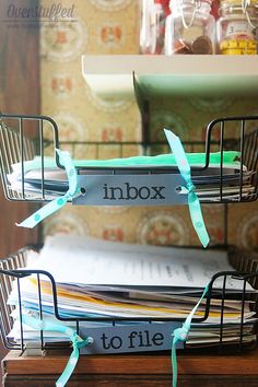 two metal baskets holding files on top of each other