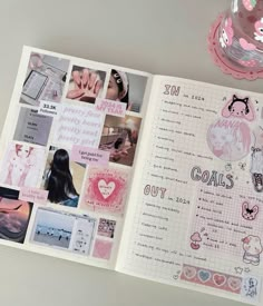 an open planner book with pink stickers and pictures on the pages, next to a cup of coffee