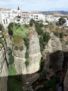 some buildings are on the side of a cliff