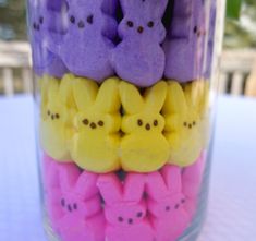 a jar filled with peepies sitting on top of a table