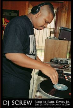 a man that is standing in front of a record player