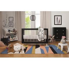 a baby's room with furniture and decor