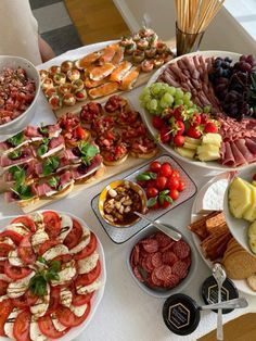 a table topped with lots of different types of food