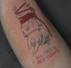 a person with a tattoo on their arm that says, all i see is red lights