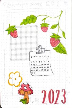 a calendar with strawberries hanging from it