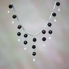 A trickling waterfall of luxurious gemstones is the feature of this stylish necklace. Celebrating the eclipse phase of the moon Indonesian artisan Wayan Sarjana combines faceted black onyx with delicate white cultured freshwater pearls. A sterling silver toggle clasp finishes this necklace. Eclipse Phase, Phase Of The Moon, Pearl Art, Waterfall Necklace, Diy Jewelry Projects, Beaded Jewelry Necklaces, Black Onyx Necklace, The Eclipse, Necklace Sets