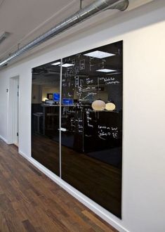 an empty office with chalkboard on the wall