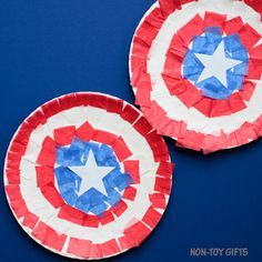 two paper plates made to look like captain america's shield shields on a blue background