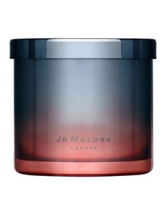 a candle that is sitting in front of a white background with the words jol malone on it