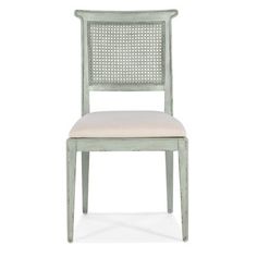 a white chair with a beige seat and back cushion on the bottom half of it