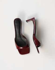 Introducing the Yadira Patent Heels, a chic blend of modern elegance and timeless appeal. These heels feature a flattering, tapered toe strap that adds a touch of refined sophistication. The low, shaved block heel provides a comfortable lift, perfect for all-day wear. Designed with an open heel counter and an open squa Red Low Heels, Cherry Red Shoes, Formal Heels, Shoes Heels Classy, Walk In My Shoes, Patent Heels, Heels Classy, Fancy Shoes, Open Toed Heels