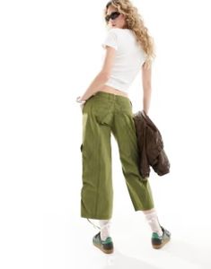 Reclaimed Vintage y2k cropped capri pants | ASOS Green Wide Leg Y2k Bottoms, Green Y2k Wide Leg Bottoms, Y2k Style Green Cotton Bottoms, Y2k Style High Waist Green Bottoms, Green Y2k Style Cotton Bottoms, Spring Y2k Style Cargo Pants, Y2k Style Stretch Bottoms With Pockets, Y2k Stretch Bottoms With Pockets, Y2k Wide Leg Green Cargo Pants