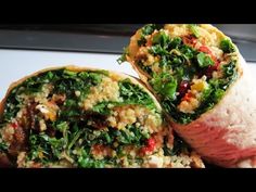 two wraps filled with meat and vegetables on top of each other