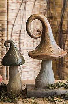 two ceramic mushrooms sitting next to each other