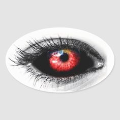 an eye with red and yellow iris