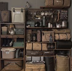 a room filled with lots of different types of bags and suitcases on top of shelves