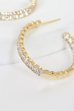 The Lulus Oh My Elegance Gold Rhinestone Hoop Earrings are a simply stunning addition to any outfit! These must-have earrings are composed of sleek gold that shapes an open hoop silhouette with sparkling cubic zirconia rhinestones and textured detailing that accent half of the outer and inner hoop. Post backs. Earring measure 1. 25" diameter. Cubic Zirconia. Balanced man made materials. Imported. Lulus | Oh My Elegance Gold Rhinestone Hoop Earrings. Streetwear Fits, Y2k Streetwear, Gold Rhinestone, Gold Hoops, Gold Hoop Earrings, Wedding Shop, Cubic Zirconia, Gold Bracelet, Bangles