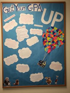 a bulletin board with some writing on it and a hot air balloon floating in the sky