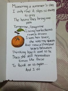 a poem written on a piece of paper with an orange in the middle and words below it