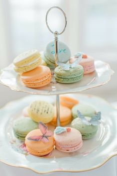 two tiered plates with macaroons on them