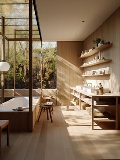 a bathroom with wooden walls and flooring next to a bathtub in the middle of a room