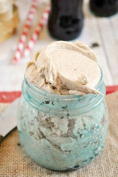 a jar filled with something on top of a wooden table