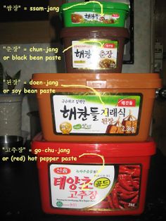 three containers stacked on top of each other with labels describing what food is in them