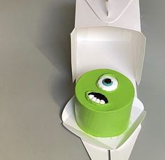 a green monster cake in a white box